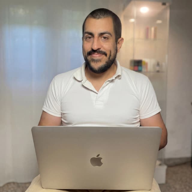 Sebas with Macbook Air